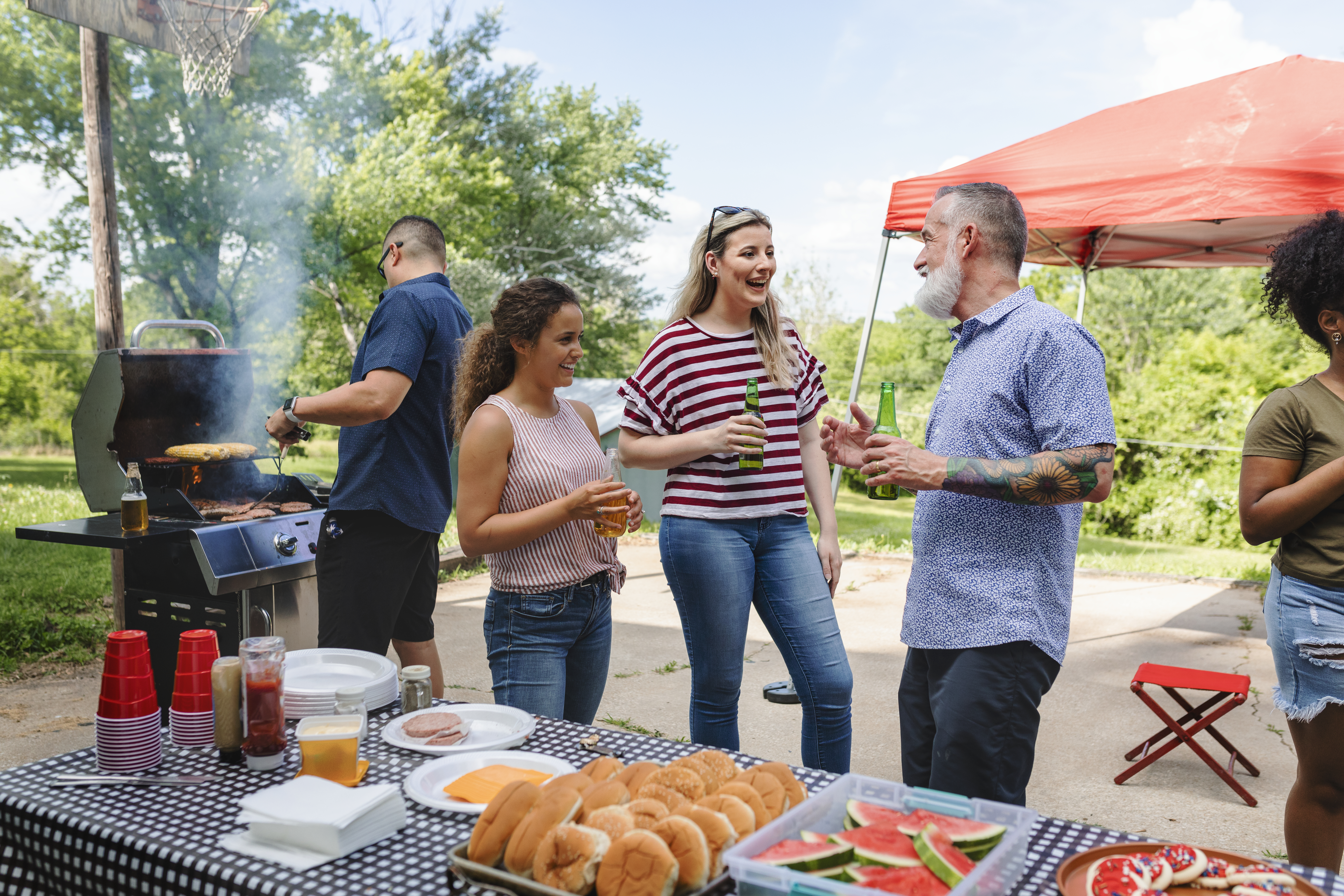 friends-celebrating-eating-tailgate-party